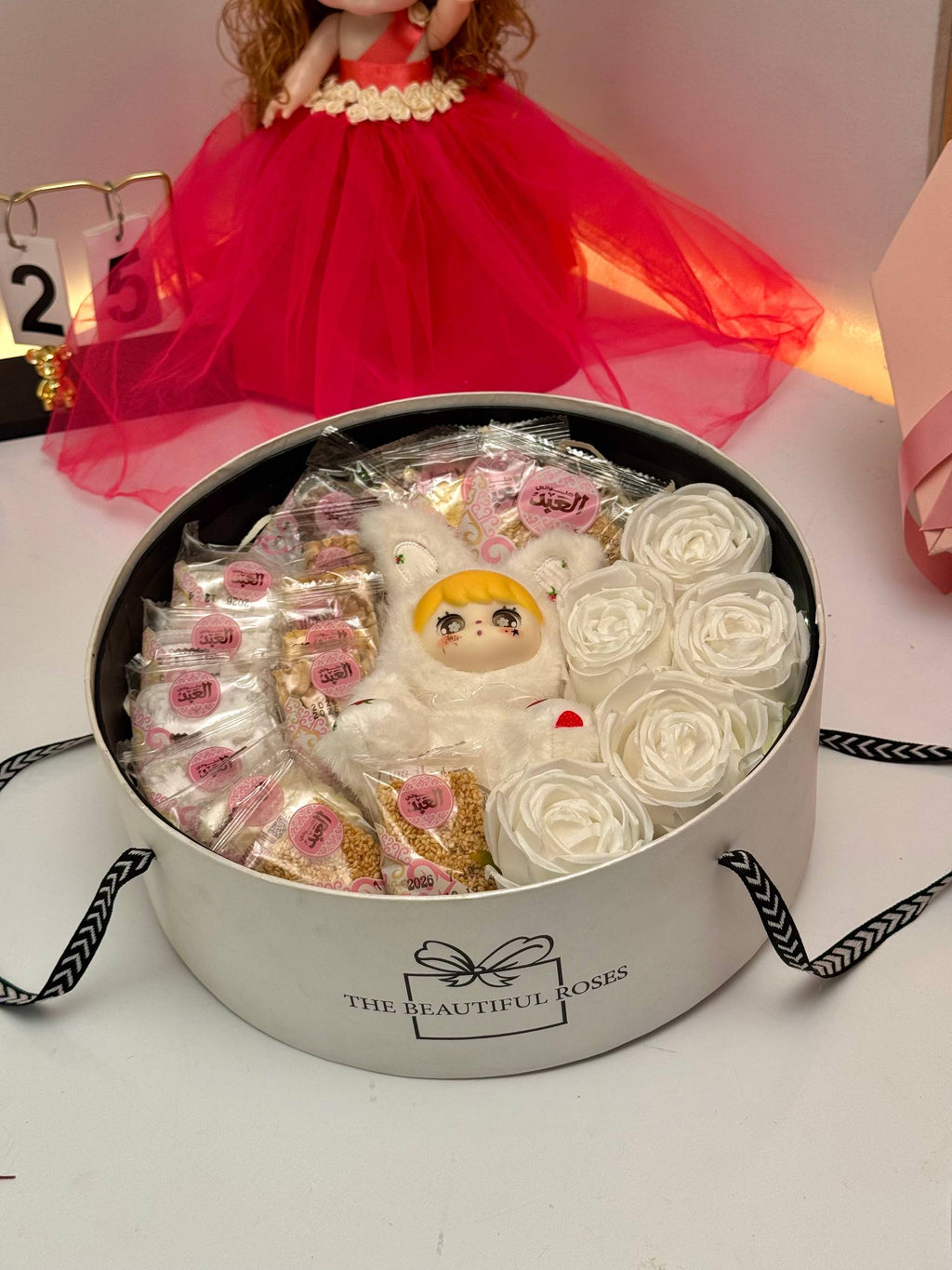Ayat Gifts Box53 round Mawlid gift box with Koti doll, Al Abd sweets and white roses
