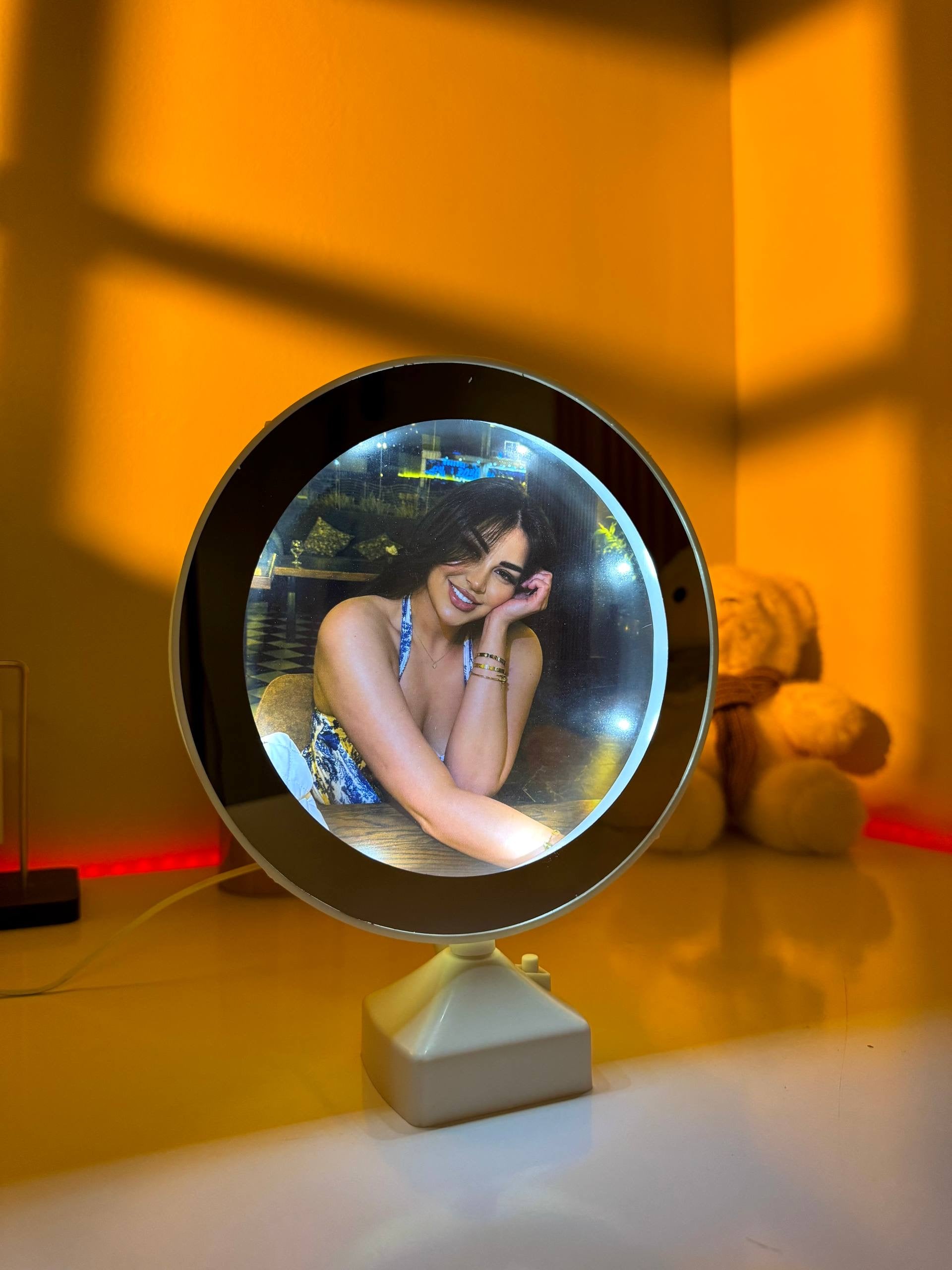 Ayat Gifts round magic mirror photo frame displaying a personalized photo with illuminated LED lights