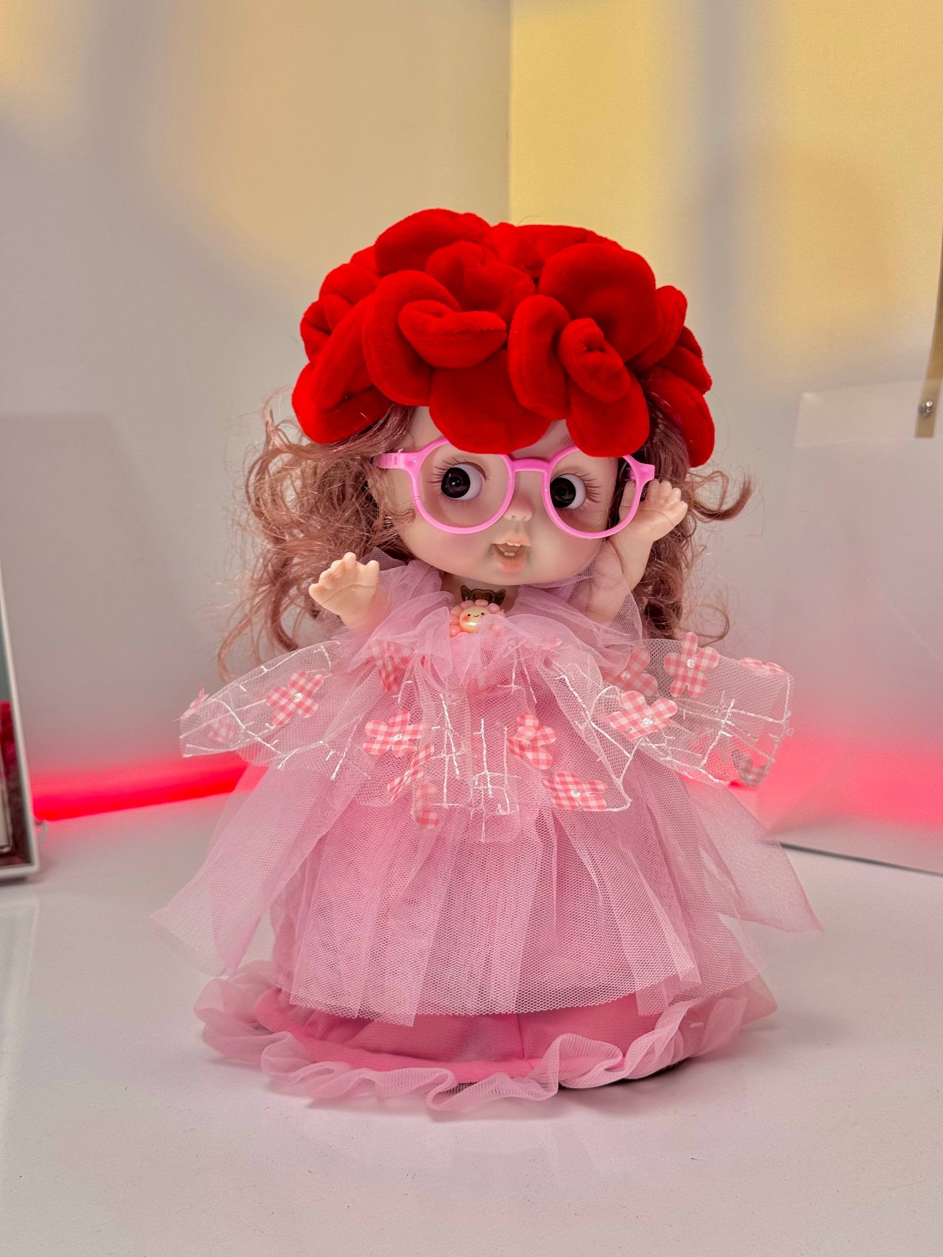 Blooming celebration doll bouquet that opens into a cute musical light\-up doll