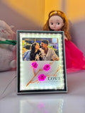 Personalized LED photo frame displaying a favorite memory with soft decorative lighting